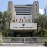 Malaysian homeowner reviewing a changing home loan instalment